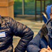 International Anchor Allies Winter 2026 First Mixer - 2 male students in group picture around a table